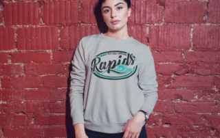 woman in grey Rio Rapids vintage style sweater