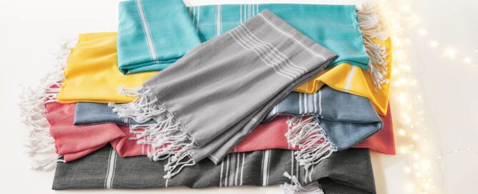 grouping of multi colored scarves with twinkle lights