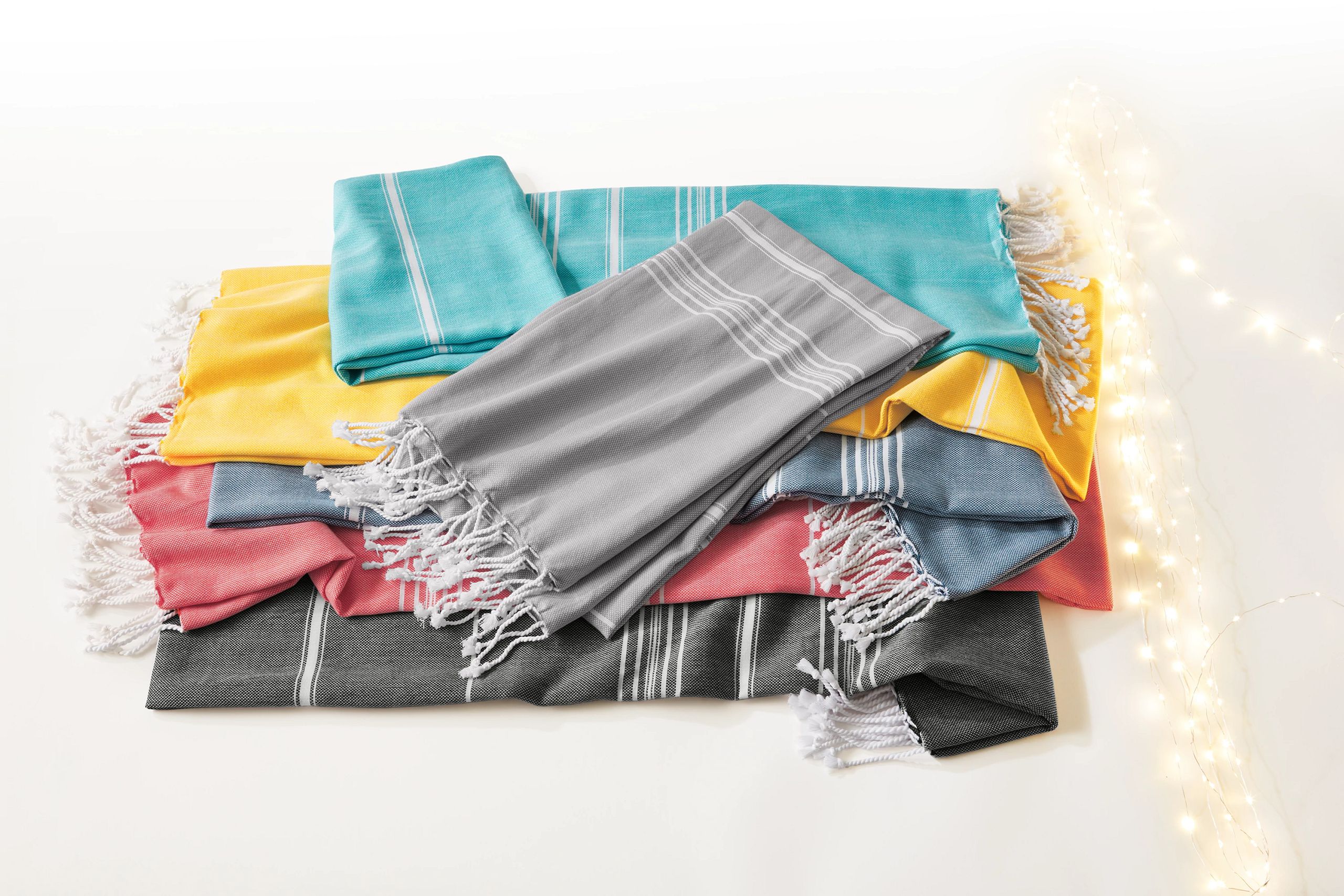 grouping of multi colored scarves with twinkle lights