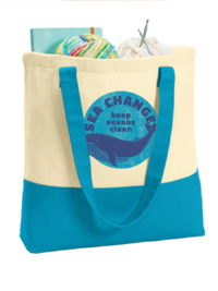 mockup of a turquoise totebag filled with yarn. The logo on the bag says 'Sea Change, keep oceans clean'